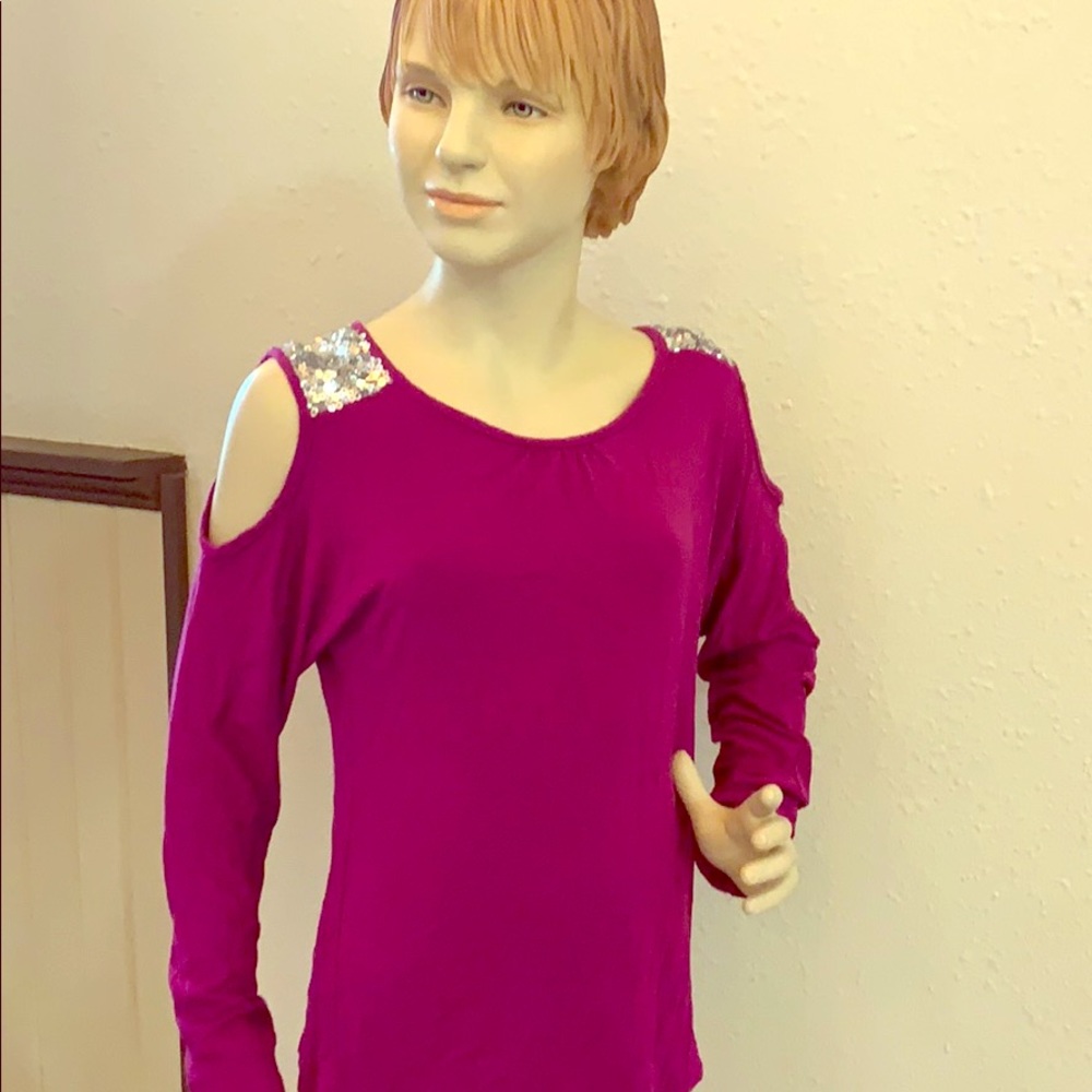 A long sleeved tee with slits on the arms